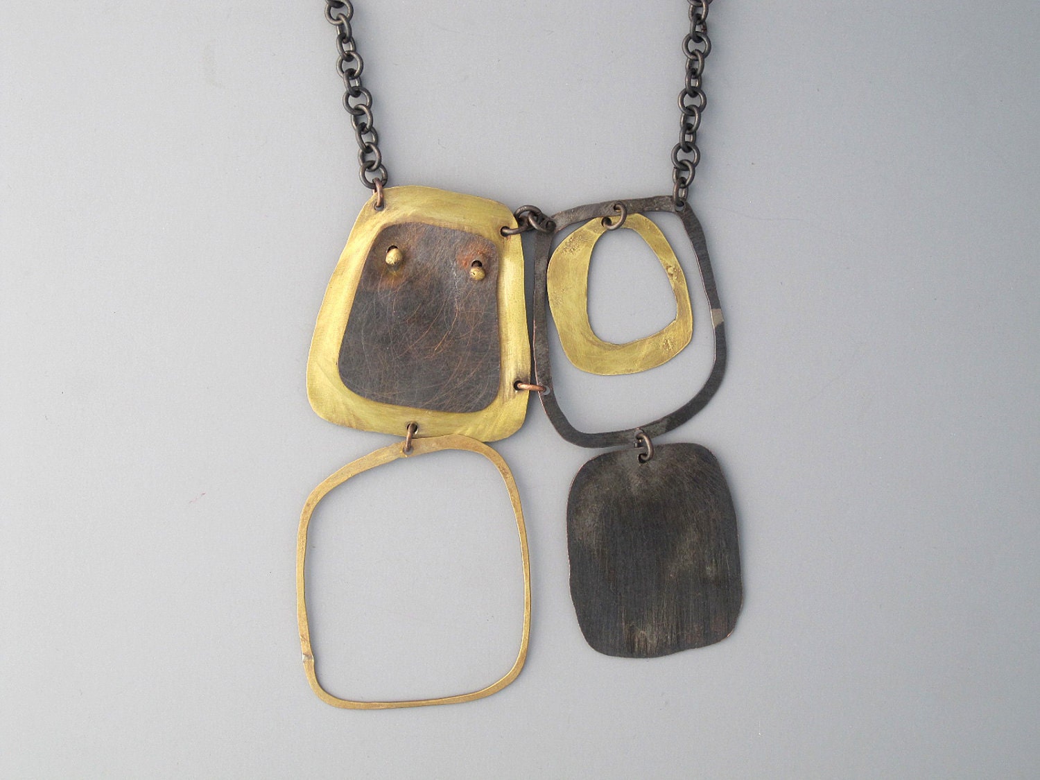 Handmade jewelry. Brass and blackened copper modern necklace.