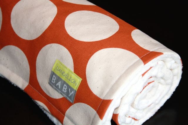 Orange Dot baby blanket backed with ivory minky dot