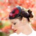 Red Fascinator Hat with Flower Shaped Sequin Embellishment and Black Chenille Veiling - JULIETTE