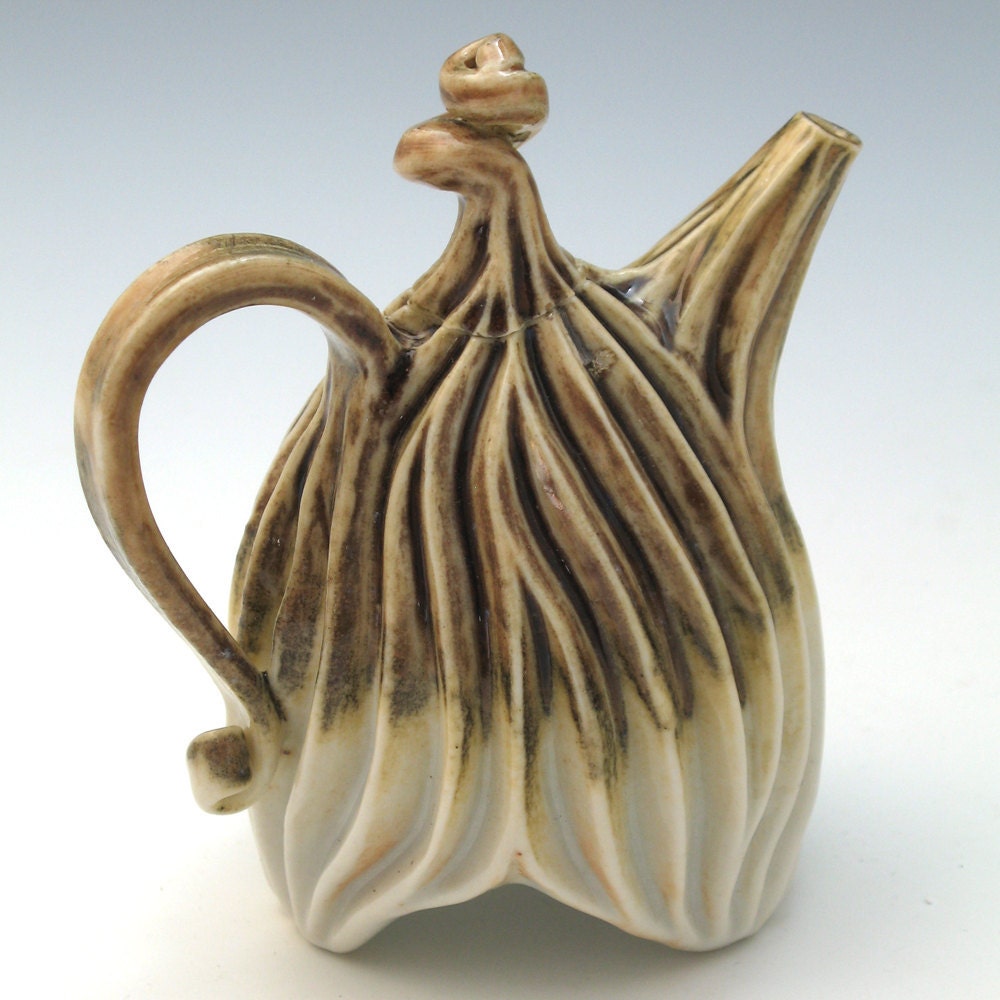 Purple, tan and white carved porcelain teapot