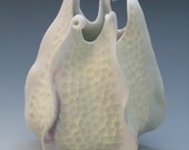 Porcelain urchin vase with curlicues in yellow & white