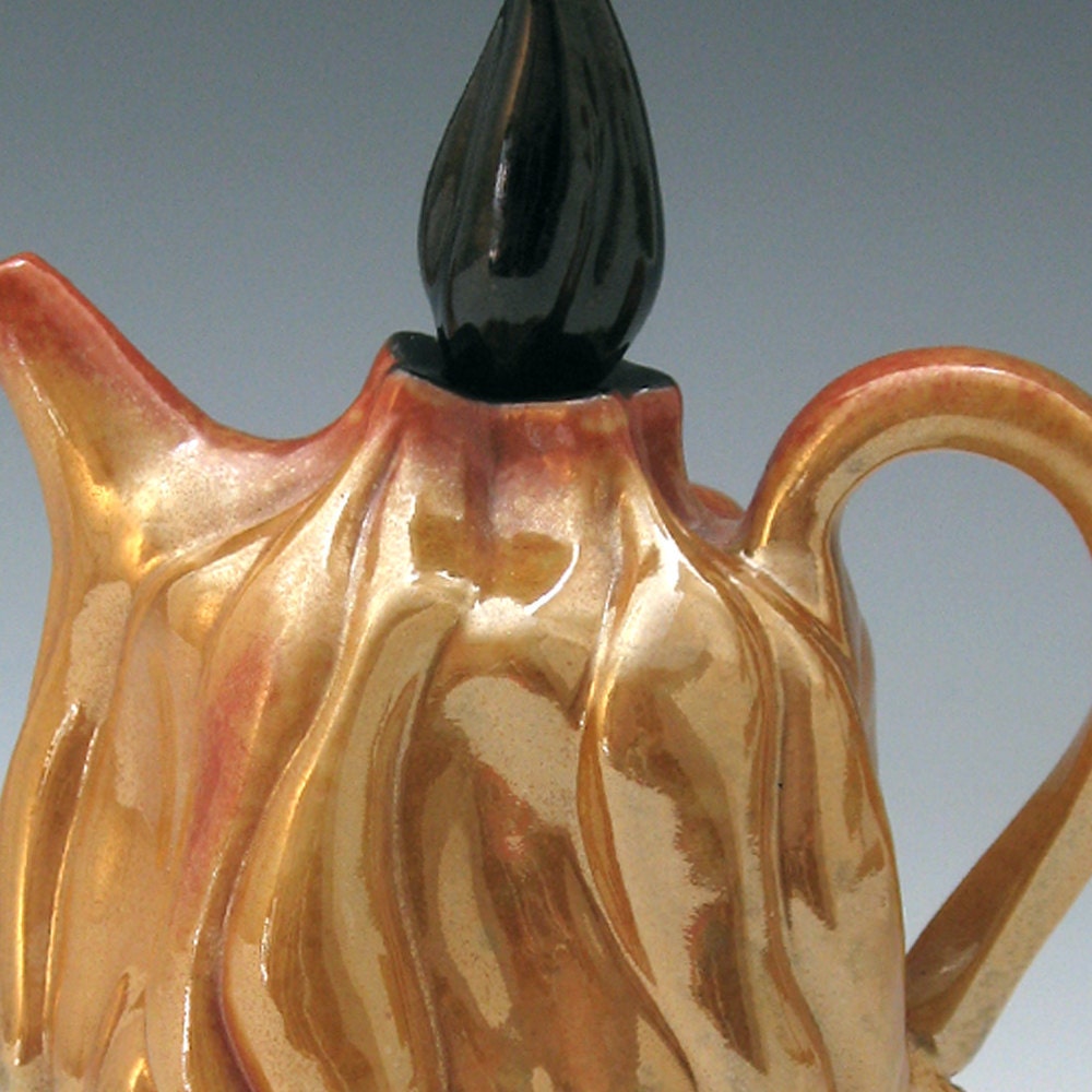 Luster flaming shino teapot with black pillow