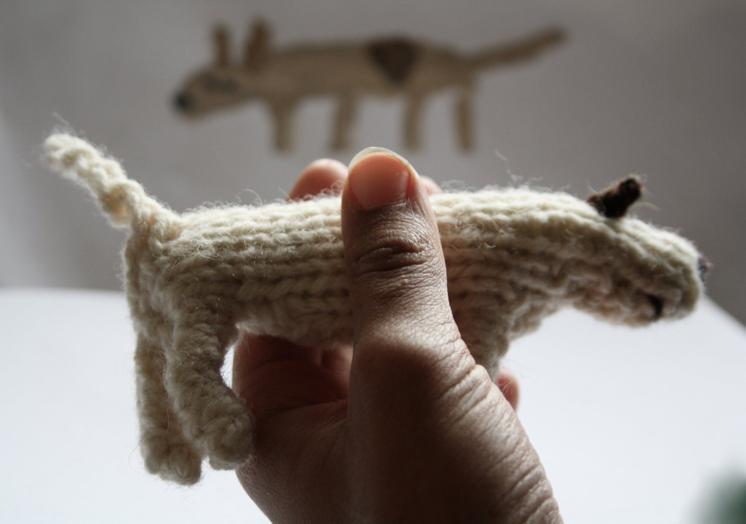 Little hand knitted patch dog