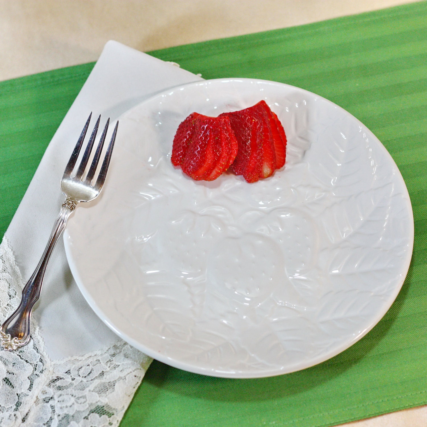 Vintage white enamel plates with embossed strawberries