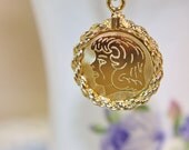 Vintage gold filled girl's head profile or silhouette CREA charm