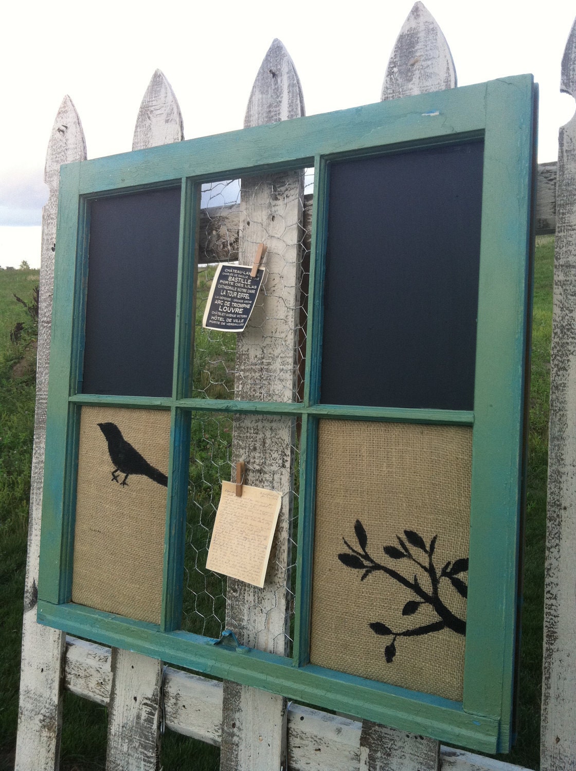 burlap covered corkboard, chalkboard, and chickenwire combo in vintage barnwood window