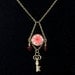 Skeleton key necklace with red and clear crystals