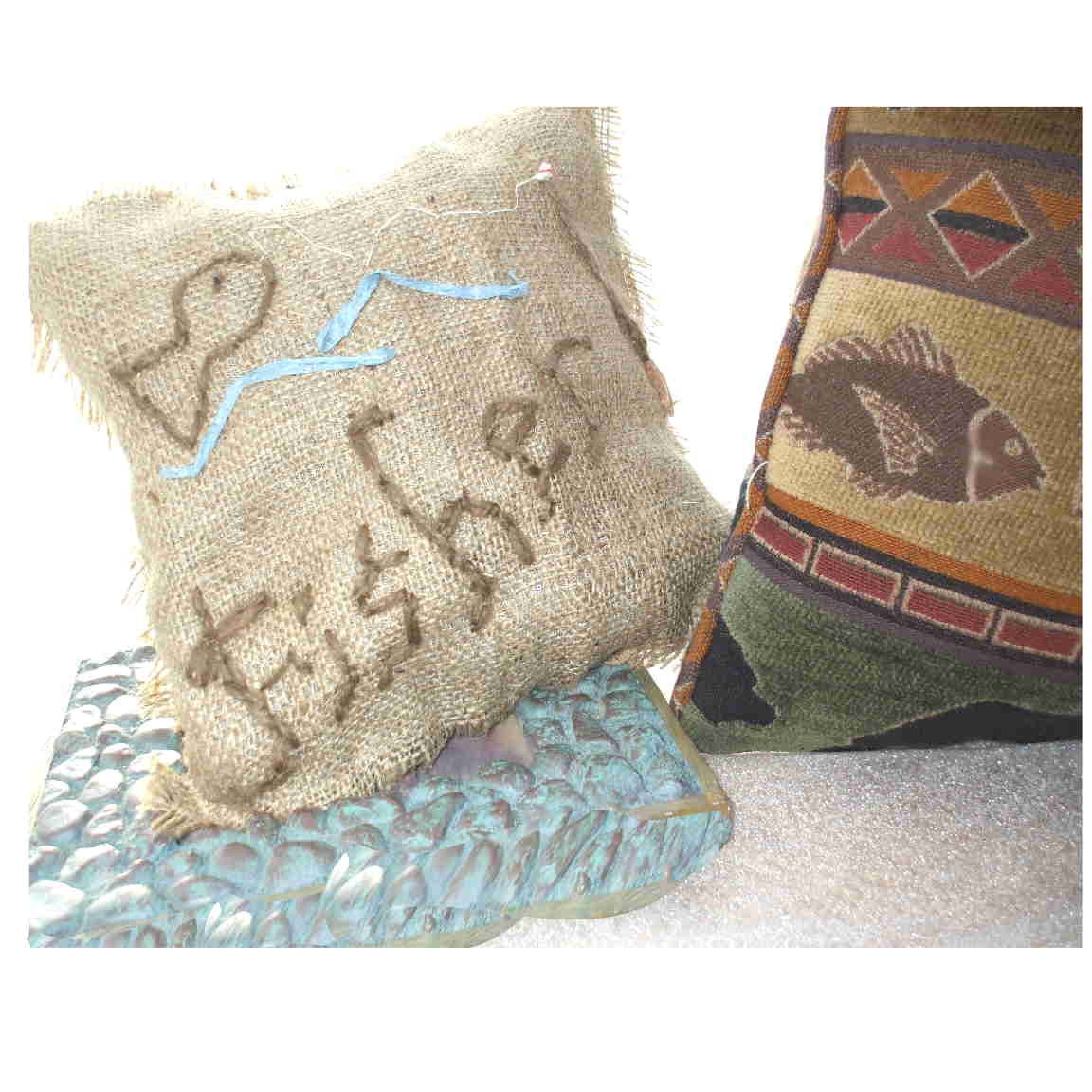 part of the "er" line... burlap and cotton reversible head cushions, 7 by 7 inches