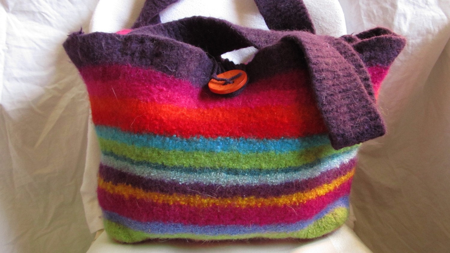 Felted Bag: Virginia Stories By Firelight. Deep plum and a bright orange button felted size large gypsy bag