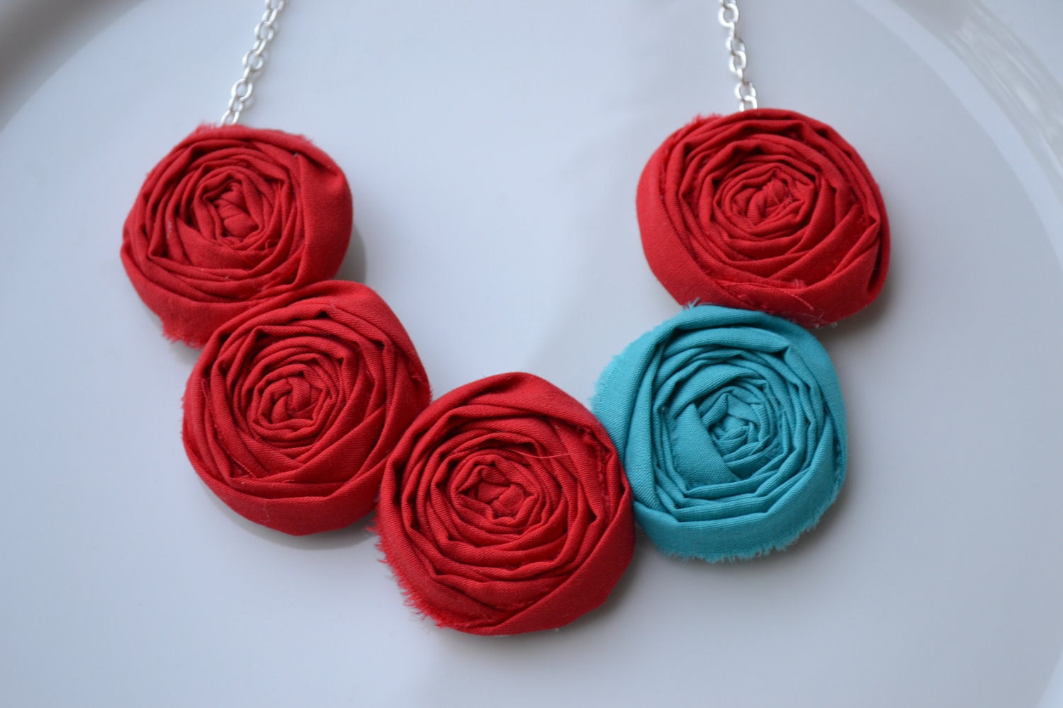 Teal and red fabric rolled rosette necklace