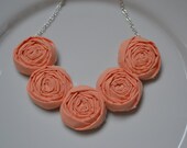Coral fabric rolled rosette necklace