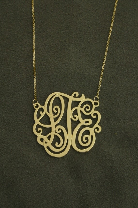 1 1/8" diameter,14k yellow gold monogram on 16" anchor cable chain .