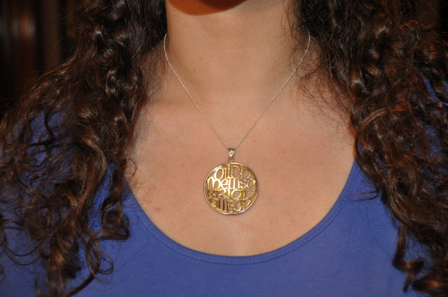 your kids or grandkids names in 1.50" circle in silver. with a cable chain.