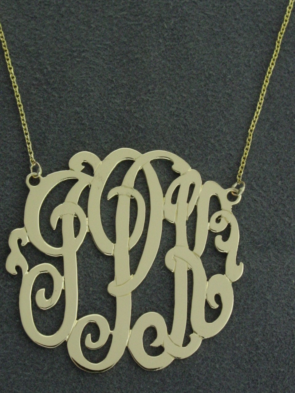10k solid gold . 3 initial. 1"size with a gold filled chain.