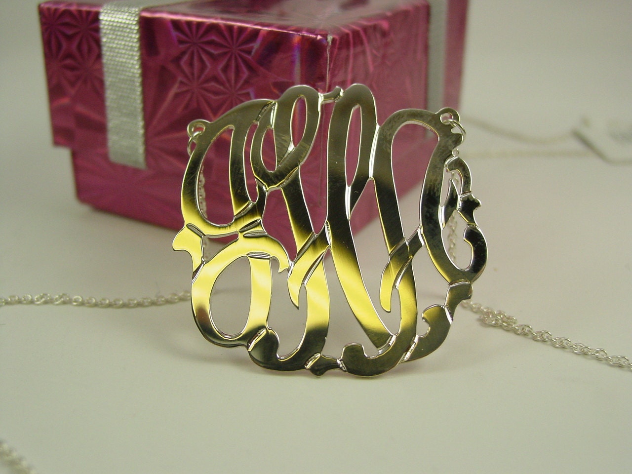 Silver monogram on  1 1/2'' diameter .any 3 letters you provide.