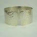 silver hammered  bangle or cuff bracelet with10 k gold initials