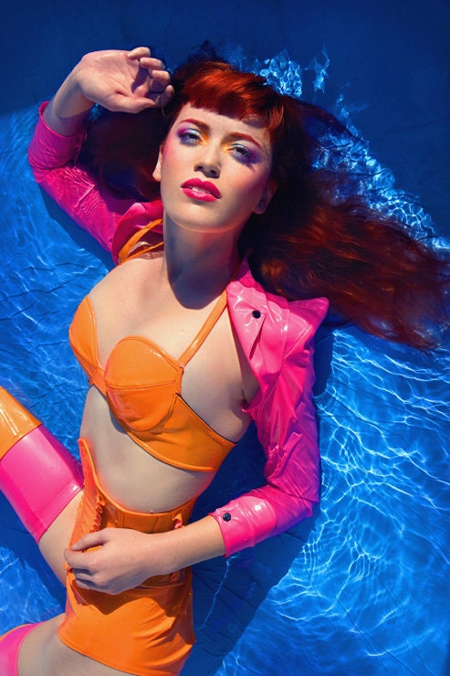 36-38 B Neon Orange PVC bra with adjustable plastic snap back and halter strap Artifice (photoshoot sample)