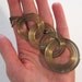 Vintage retro groovy 1970s tribal brass ring pendant
