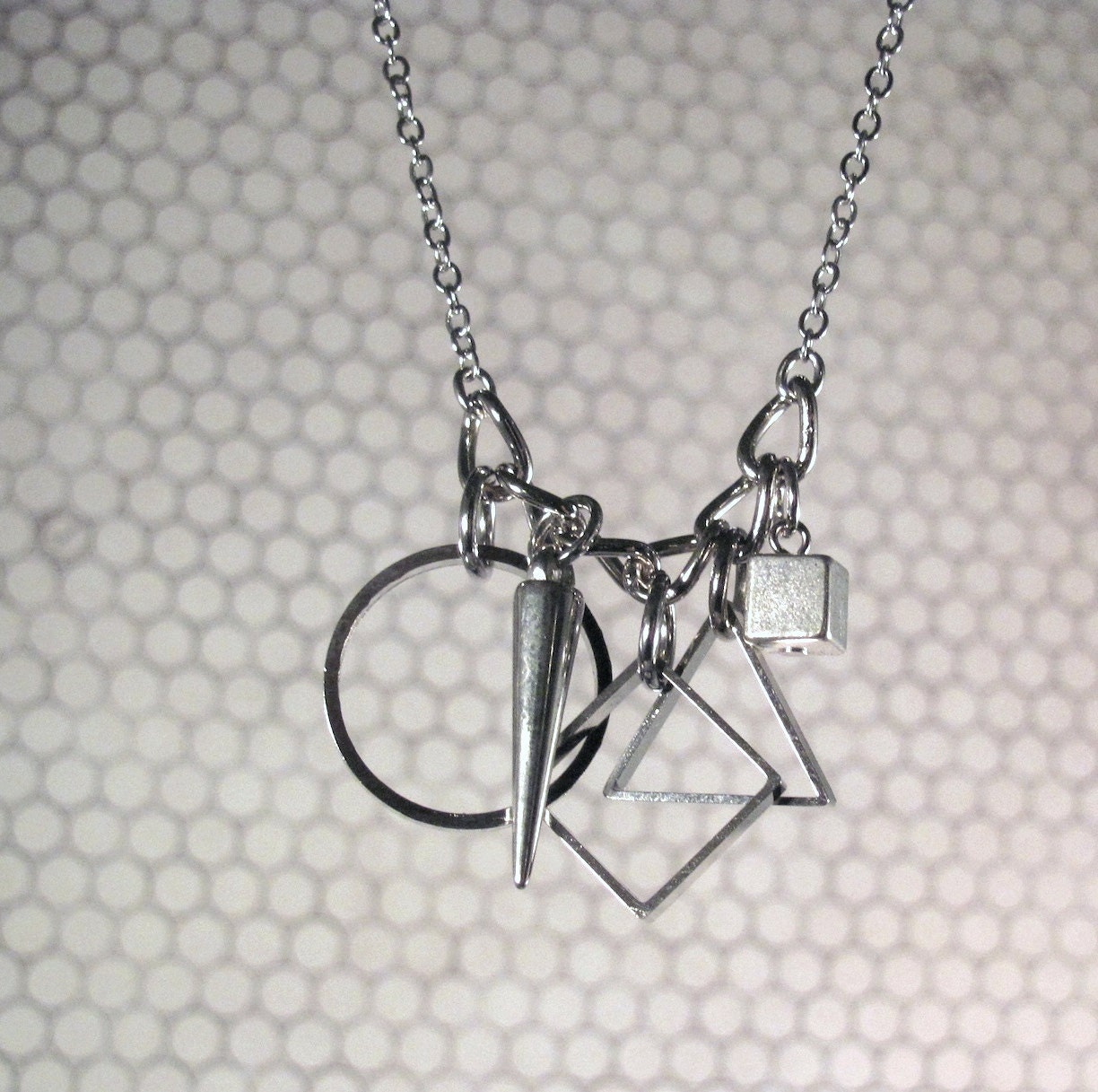 Eutrigon - Triangle Geometric Necklace with Circle, Squares & Spike Pendants on Silver Chain