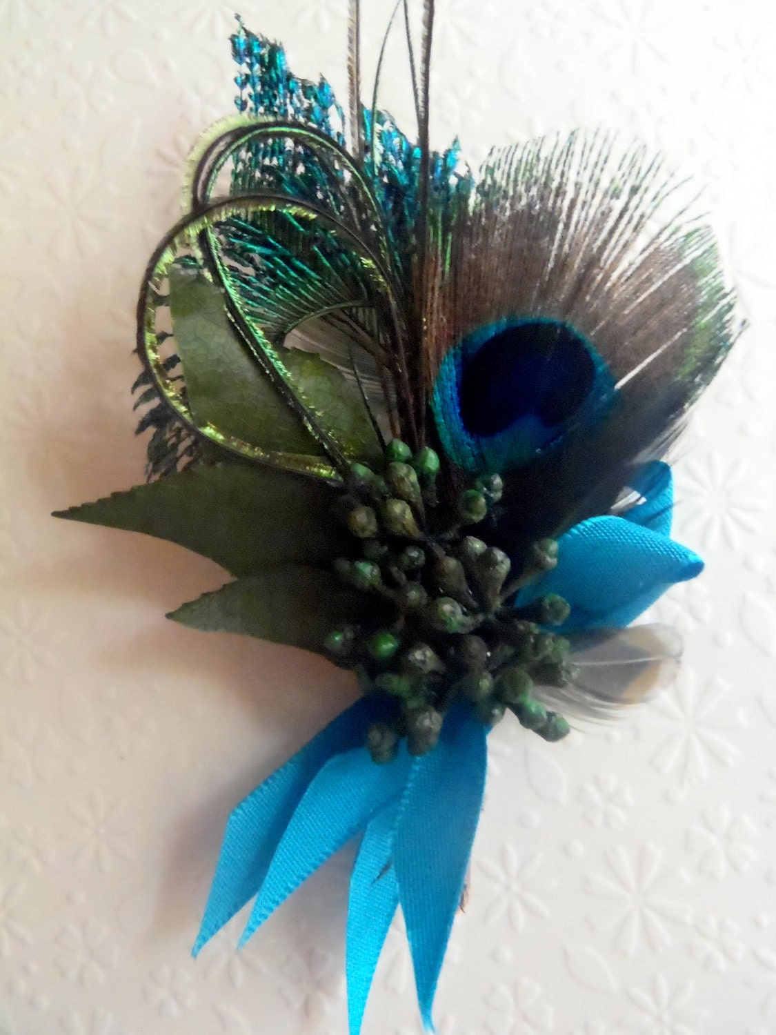 Peacock boutonniere, lovely and elegant classic favorite