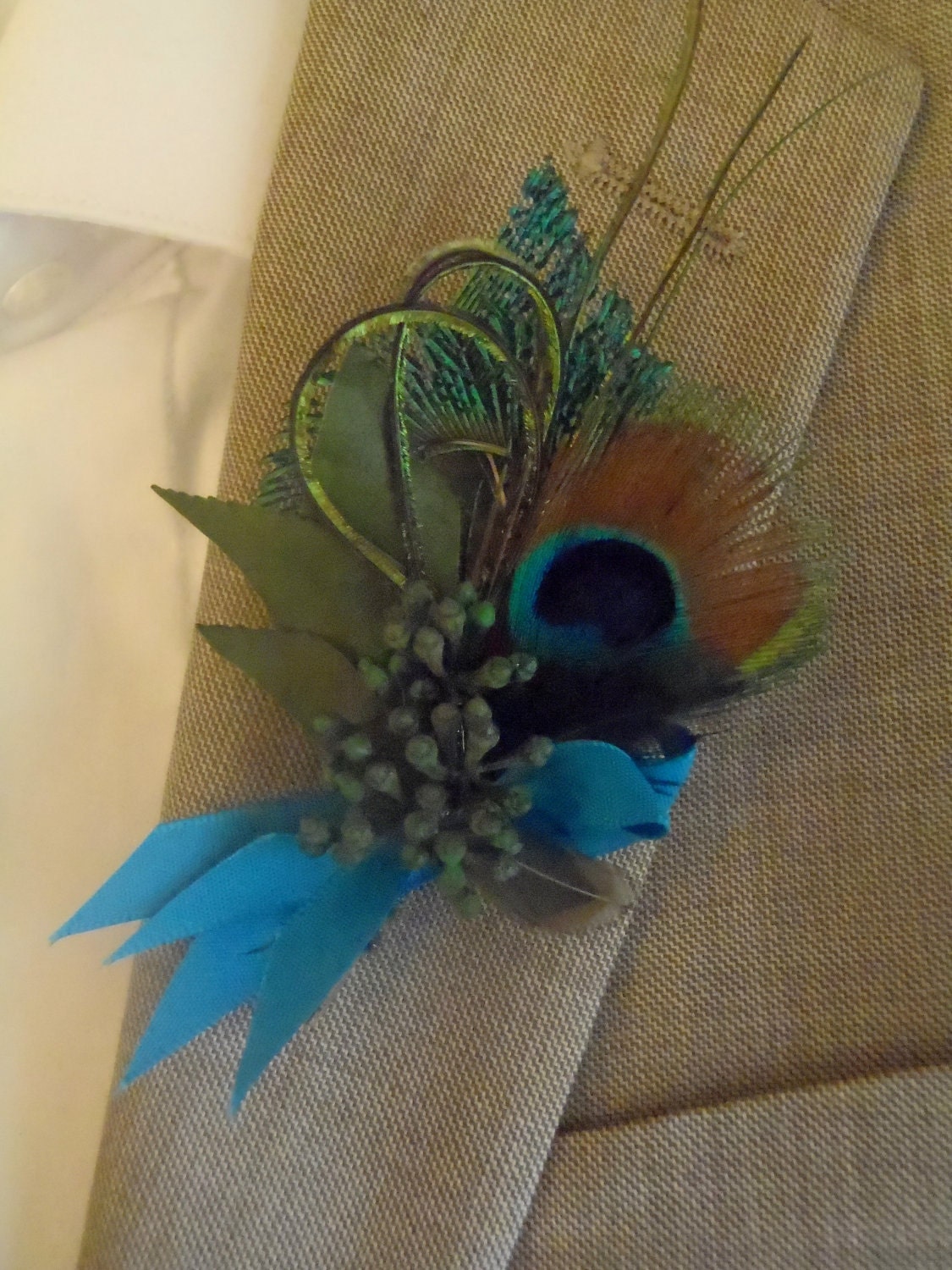 Peacock boutonniere, lovely and elegant classic favorite