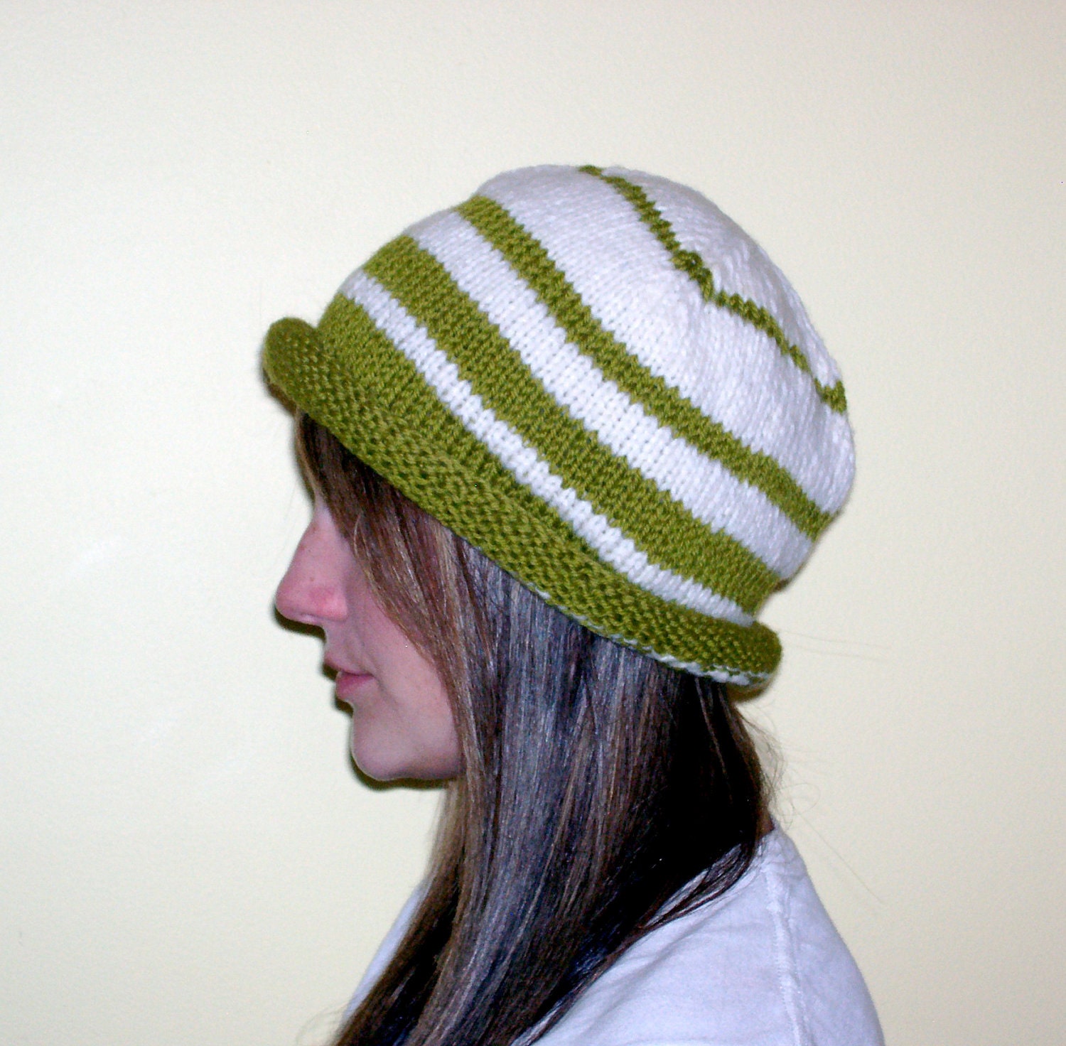 Green and white striped handknitted wool hat
