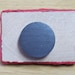 red heart on red, purple, and blue background magnet