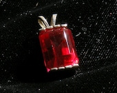 Heavy dark ruby pendant in silver.