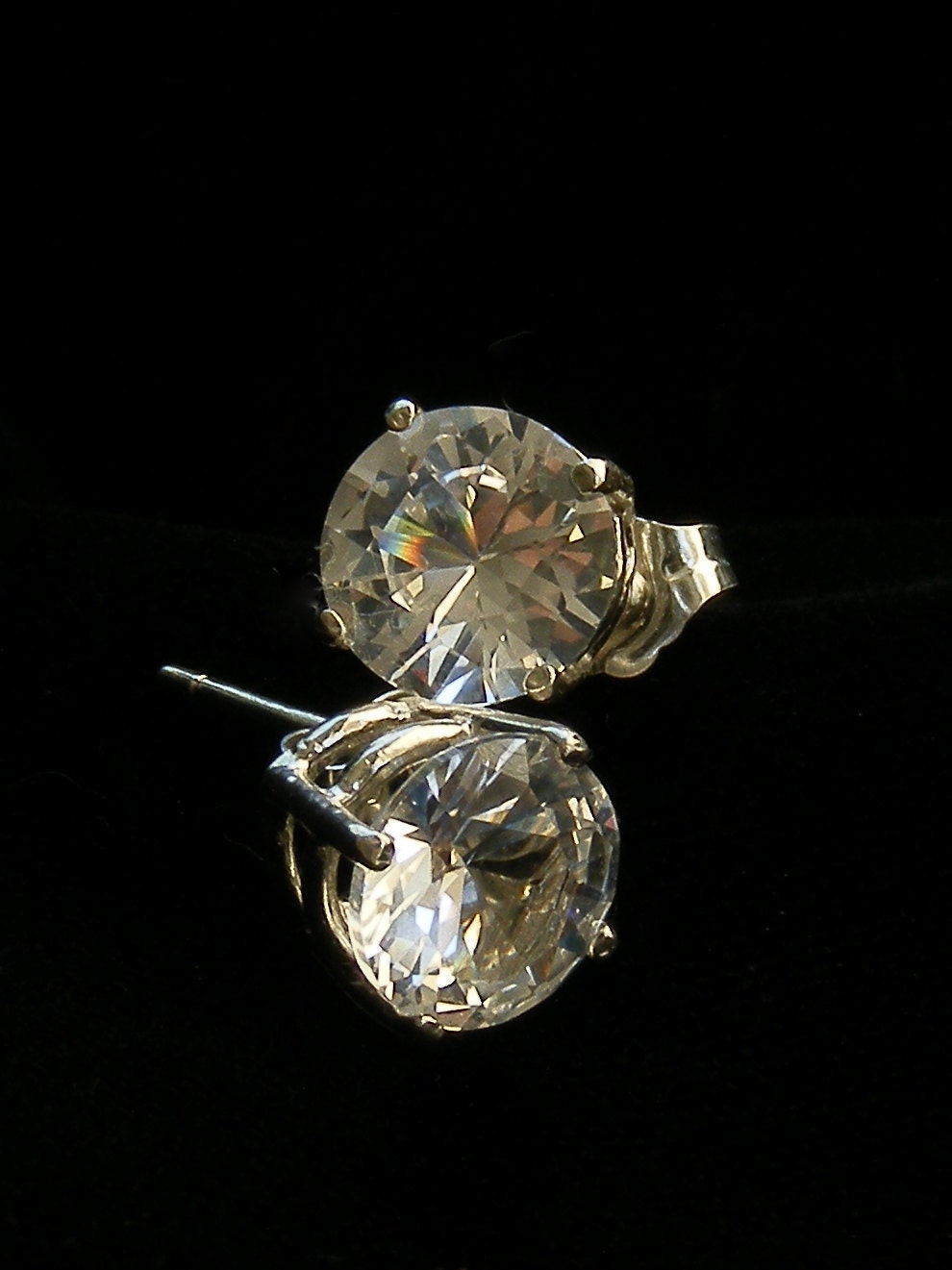 White sapphire solitare earrings.