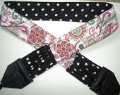 Black Polka Dot in a Modern Day Garden Camera strap, reversible, 2 expandable pockets with stretchable elastic.