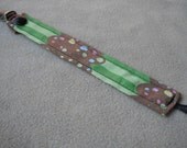Fabric Pacifier Clip - Green Cupcake with Skull Sprinkles Print - Universal Soothie Nuk Mam Gumdrop Avent