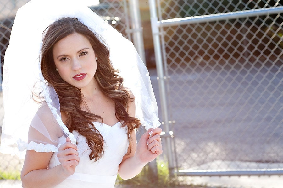 The Savannah, a white, two tiered, elbow length ruffle veil with a blusher