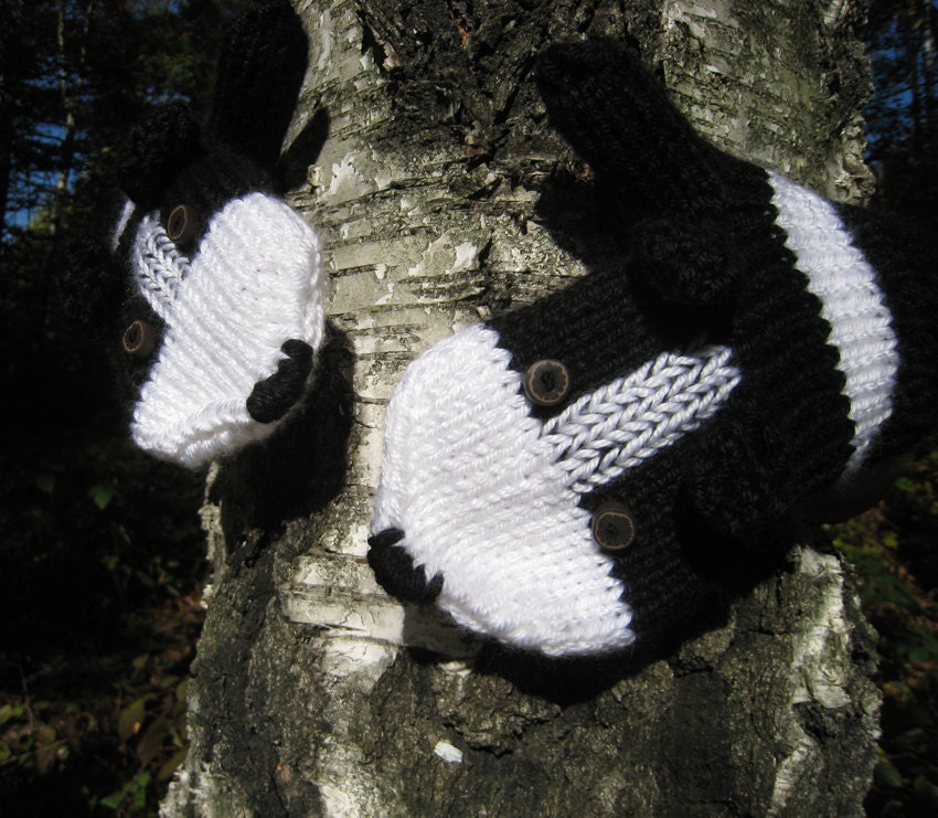 Hand knit Border Collie mittens gloves in black and white with polymer clay buttons