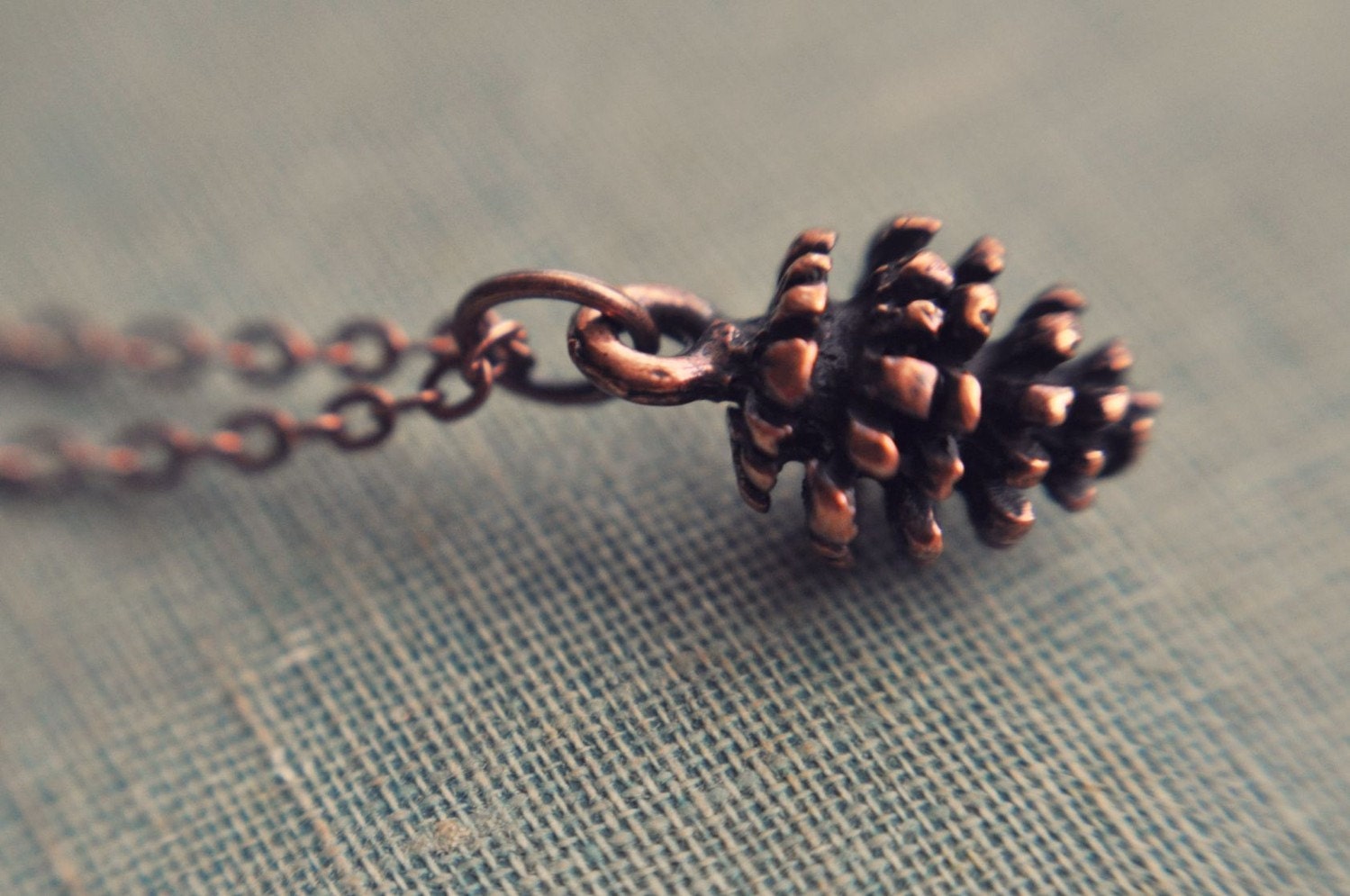 petite pine cone necklace.