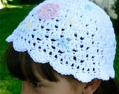Award Winning Delicate pink, yellow and blue wildflowers with green vines on white mesh child's crochet beanie