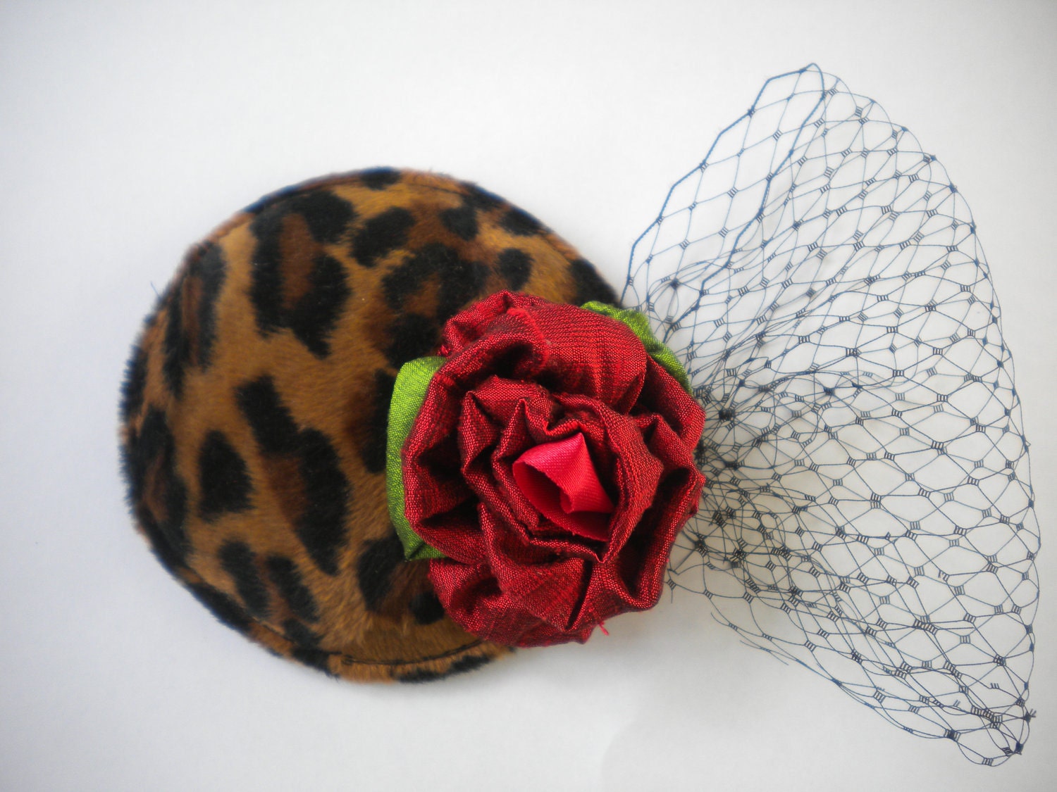 leopard print mini cocktail hat with raw silk rose