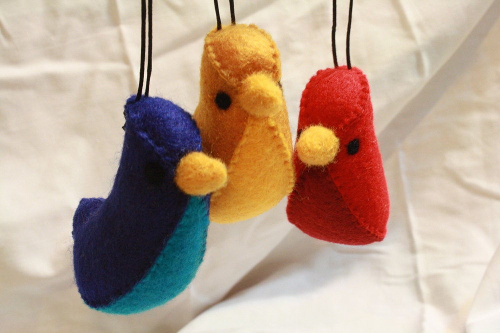 set of red, blue and yellow "banana bird" felt ornaments