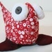 beady-eyed fish in red and white cotton print