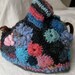 Tea Cozy made in Freeform Crochet and knitting - blue, pink, and charcoal with a hat