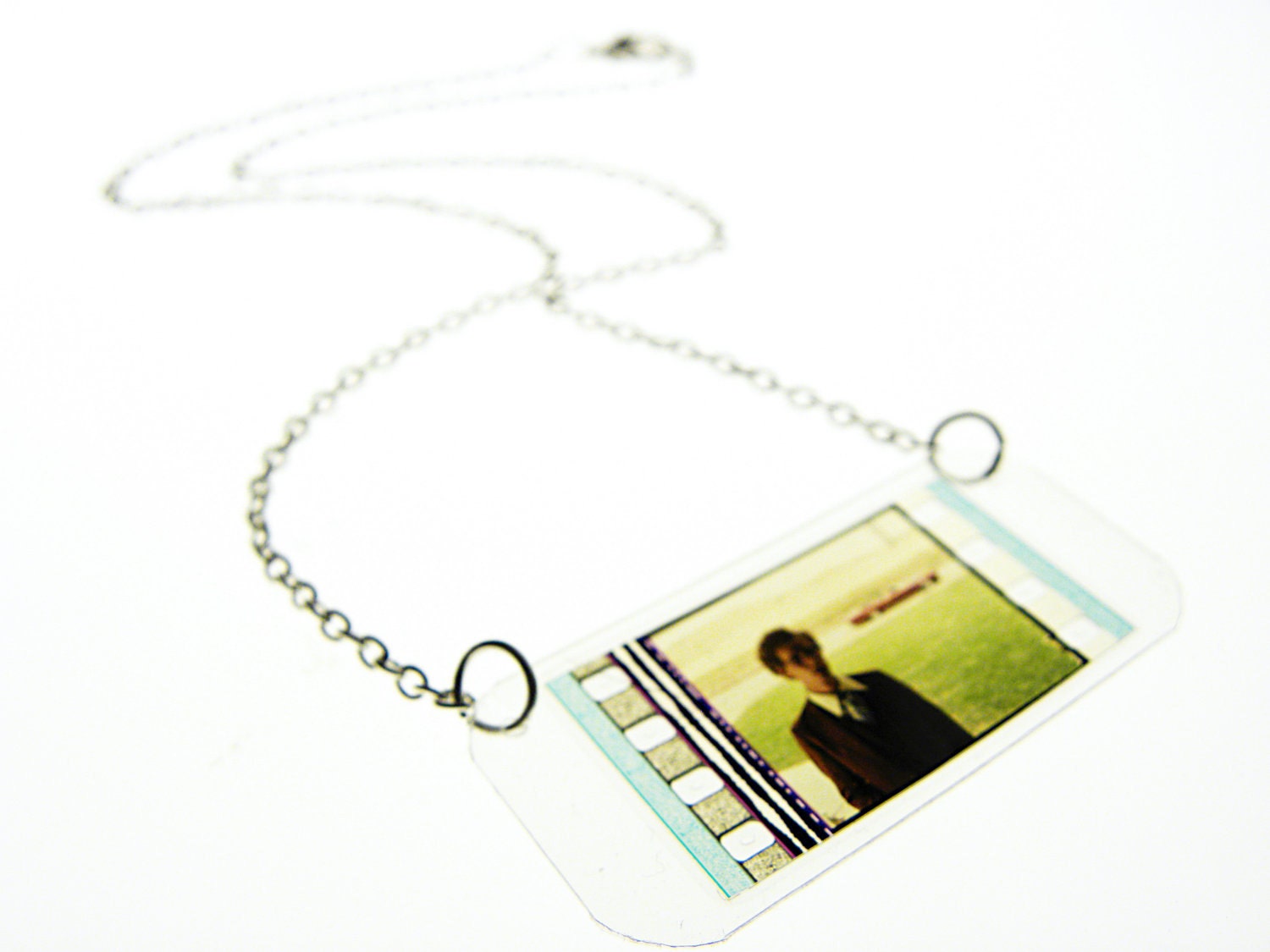 laminated filmstrip necklace . Napoleon Dynamite movie . cinema cult classic . oscar academy awards