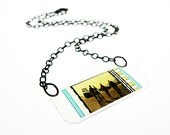 laminated filmstrip necklace . ET movie Extra Terrestrial . cinema classic . oscar academy awards