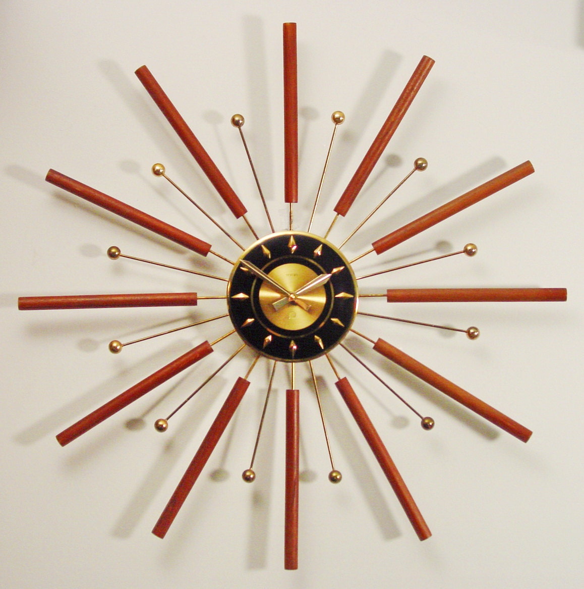 Starburst Wall Clock, Mid-Century Modern Sun Burst design.