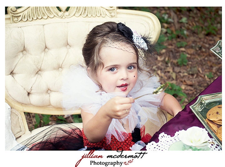 Queen of Hearts inspired tutu dress. Crocheted red and black top. White tutu collar with spades and hearts. Featured in Model Life magazine