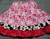 Size 4 ready to ship COWGIRL skirt, pink sparkling print with a touch of cowprint .  two size 4 are available for immediate shipment