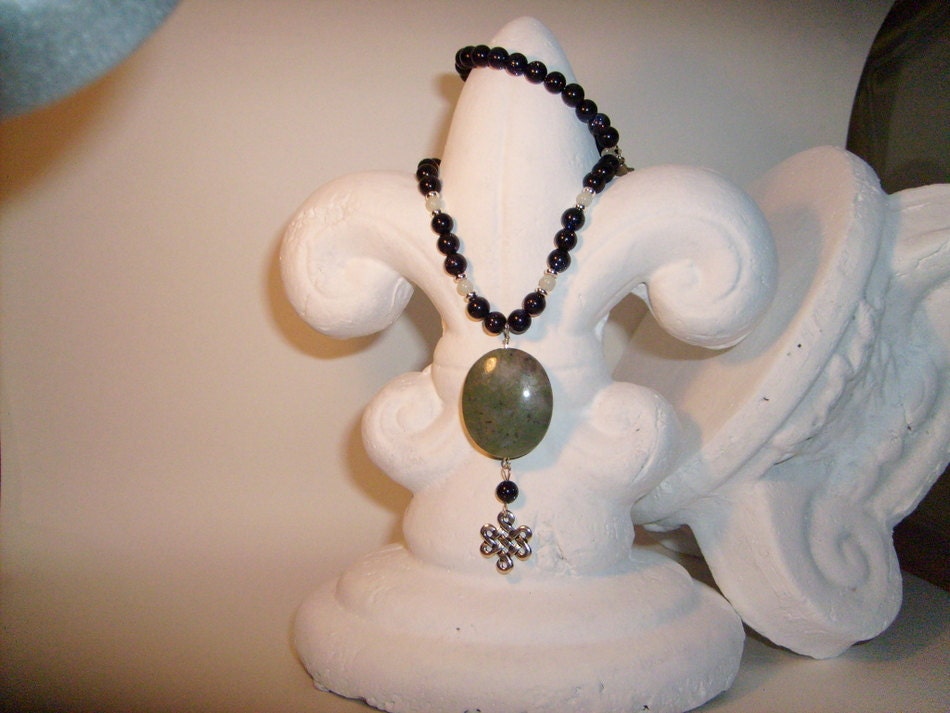 Blue goldstone eternity knot necklace 18in