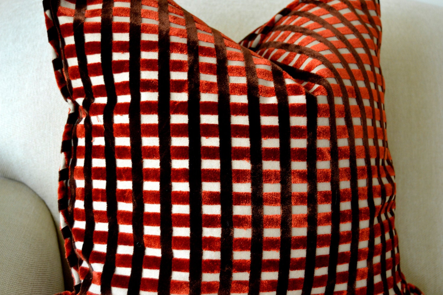 A Pair of Brick Red Cut Velvet Pillows