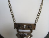 Vintage Door Plate Necklace with Keys and Charms. As featured in Country Living Magazine.