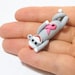 READY TO SHIP: Sock Monkey Pendant Clutching Pink Awareness Ribbon in Traditional Gray Polymer Clay