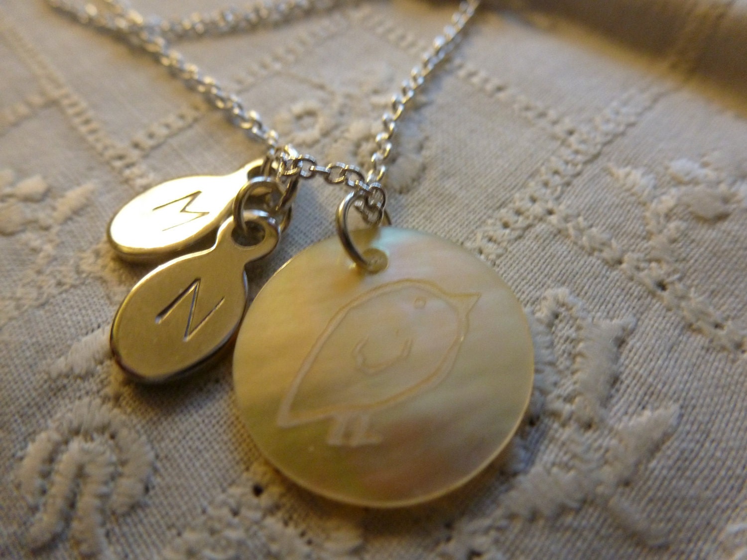 Sterling Silver Necklace with a Mother of Pearl "Chick" Pendant and 2 Initial Charms