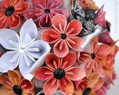 Peach, pink, white, and black bouquet with matching boutonniere